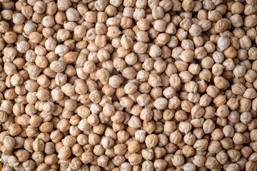 Food background from a texture of raw chickpeas close-up