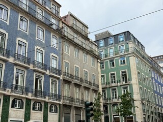 Historical houses with facades made of colored ceramic tiles in the old town of Lisbon. Symbol of Portugal