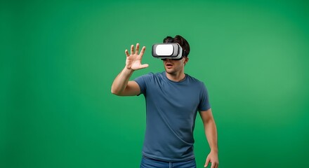 Man wearing virtual reality headset gesturing with hand on a vibrant green background, showcasing immersive technology and interactive experiences