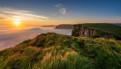 serene sunrise over cliff edge with lush green grass and gentle mist in the background capturing nature s tranquil beauty at dawn