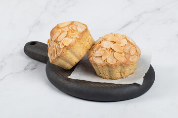 Vegan Almond cake. On a wooden board. White background
