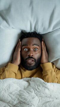 Awakening surprise: man wakes up shocked in bed to noise