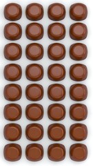 Rows of round, brown candies