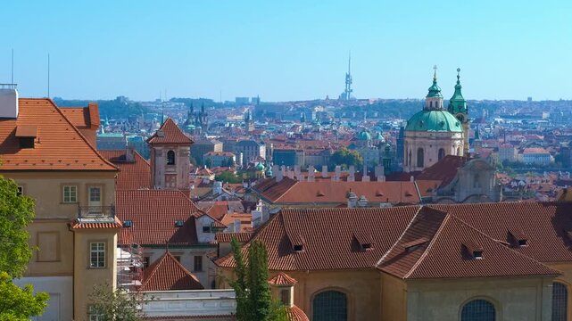 Panoramic view of prague with zizkov television tower. Red rooftops dominate the foreground, leading the eye towards the iconic zizkov television tower and the sprawling cityscape of prague