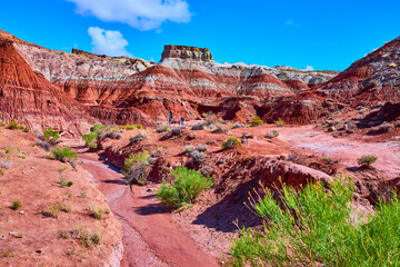 Painted Desert Badlands and Mesa with Stream Bed and Hikers Arizona Daytime