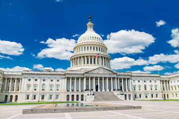 United States Capitol under a bright blue sky. A powerful symbol of American democracy and...