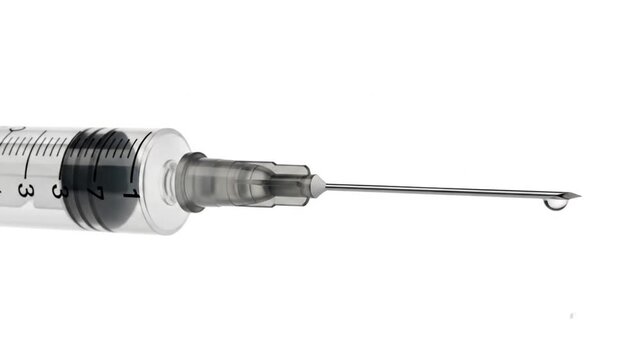 Close-up view of a medical syringe with a needle isolated on white