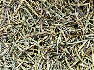Organic dried rosemary aromatic herb top view background texture.Food, healthy lifestyle, popular spices concept.