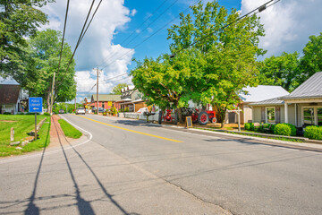 Shops, boutiques and cafes along the main street of the charming small town of Leiper's Fork Tennessee on a summer day.