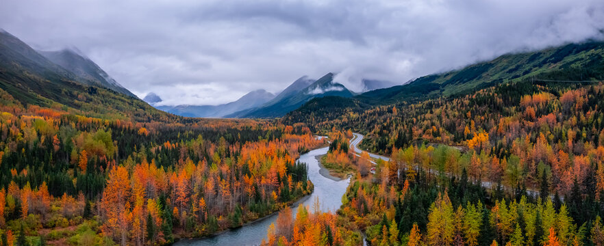 Panoramic view of Scenic landscape in autumn time in Alaska on the way to Seward with low level clouds.