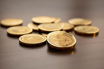 closeup golden wedding arras coins