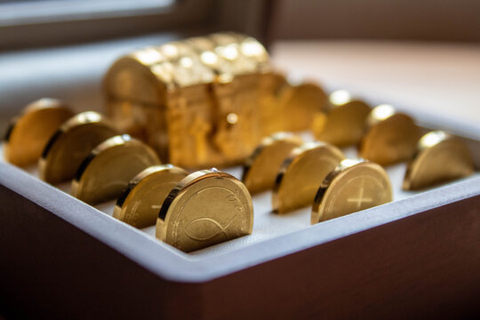 symbolic golden wedding coins detail