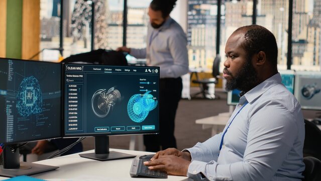 Engineer upgrades turbine component with machine learning to maximize sustainability. African american man uses AI tech to refine blade aerodynamics, boosting clean energy output, camera B