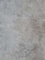 A light chalky grey surface with a slightly uneven texture provides a neutral and adaptable backdrop suitable for showcasing a wide variety of products