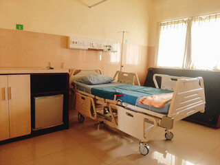 a patient's bed in a hospital being dried in the sun