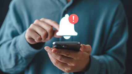 Checking mobile notifications on smartphone with bell icon and exclamation mark for new messages alert 100