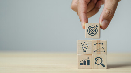 Business strategy planning and goal achievement concept with wooden blocks stack up 100 character