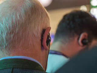 Elderly Man Wearing Headphones Listening to Music