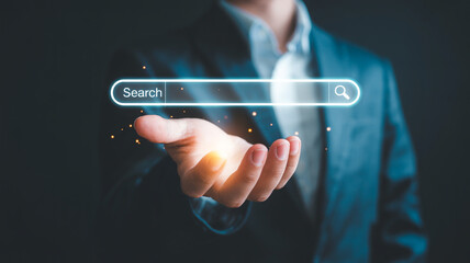 Search engine optimization concept hand holding search bar internet marketing digital technology online 100