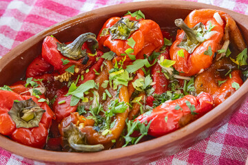 Cooked red peppers with parsley.