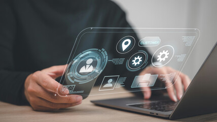 Futuristic technology interface on transparent screen with laptop for business management app