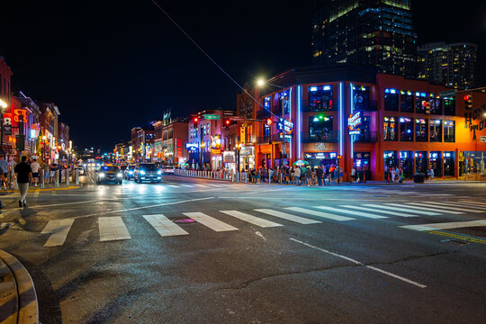Late night view of the colorfully illuminated Broadway Street, the central hub of the Honky Tonk Highway entertainment district in downtown Nashville, Tennessee, July 9 2025.