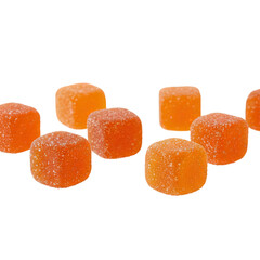 Bright orange sugar-dusted gummy cubes arranged in a vibrant, tempting row for indulgence