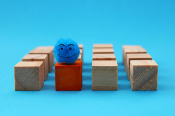 Happy leader on wooden cubes