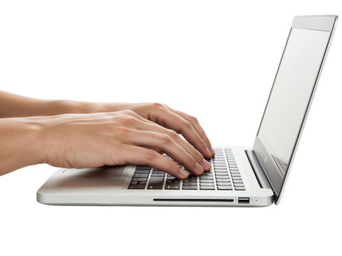 Close up side view of hands typing on a modern silver laptop keyboard isolated on transparent background