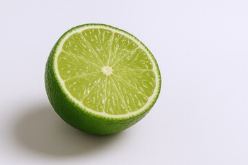 Bright Half Lime Slice Isolated on White Background for Culinary and Beverage Use