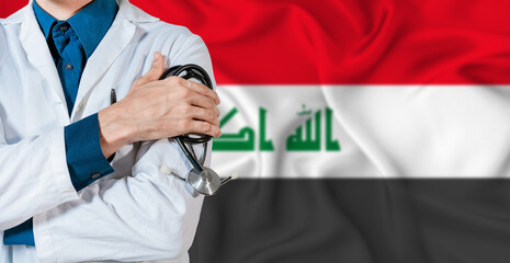 Doctor with stethoscope on Iraq flag. Doctor holding stethoscope on Iraq flag