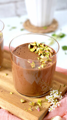 Creamy chocolate mousse dessert with pistachios
