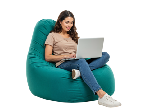 Young woman comfortably sitting on a large teal beanbag chair using a laptop isolated on transparent background