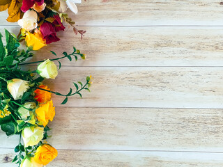 background of colorful pink flowers on wood and with space for text representing spring