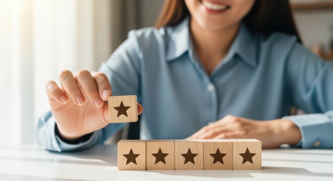 Smiling woman holding star rating wooden block for customer satisfaction, positive feedback and five stars quality evaluation.