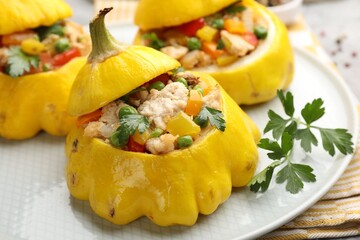 Tasty stuffed pattypan squashes on grey table, closeup