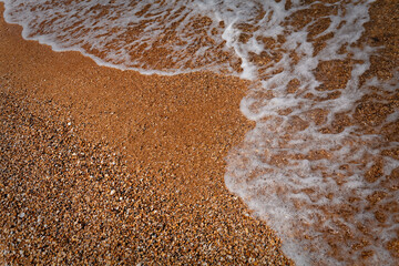 Waves Lapping Sandy Pebble Beach From Above