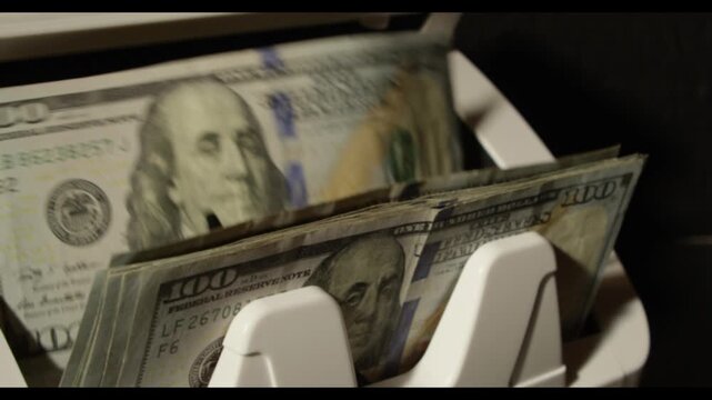 Counting cash. Dollar bills motion. Cash machine count dollar in action. Dollars paper money. Counting 100 dollar bills. Easy money. Counting machine with dollar bill. Money counter. Banking concept.