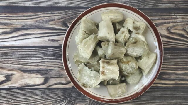 A delicious pile of boiled sweet potato slices on a plate. Ipomoea batatas L. is a tuber that is widely found in Indonesia and is beneficial for digestion.