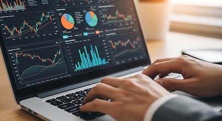 Analyzing the Analytics: A professional focuses intently on a laptop screen showcasing intricate data visualizations and financial charts.
