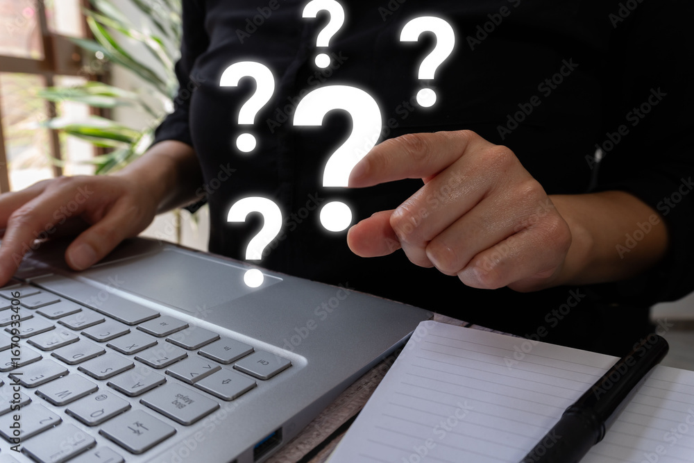 Poster person in front of a laptop pointing at a question mark, there are more around it