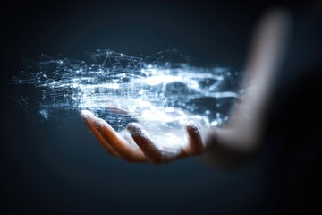 A hand holds a glowing network of light