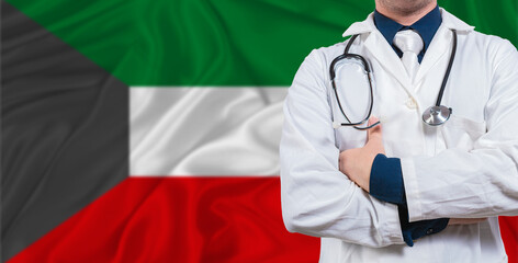Male doctor with stethoscope on Kuwait flag. Doctor holding stethoscope on Kuwait flag