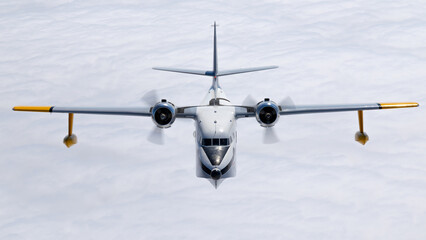 Frontal view of a HU-16 Albatross (post WWII flying boat) over cloud layers
