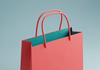 A coral shopping bag with light teal interior  matching coral rope handles on a gray background