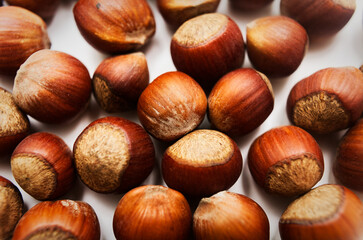 Hazelnuts Piled Together on White Background