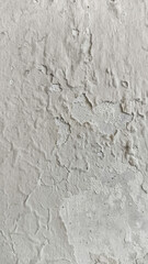 Textured weathered grey wall surface with dirt, stains, and peeling paint. Perfect for use in backgrounds, architectural decay projects, and design elements requiring a grunge texture aesthetic.