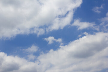 Blue sky with puffy clouds