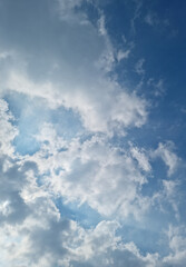 The sky is covered with fluffy clouds.