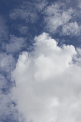 The sky is covered with fluffy clouds.